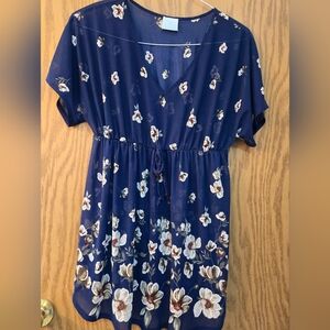 Pretty dark blue, sheer, short sleeve, v neck blouse with elastic waist.